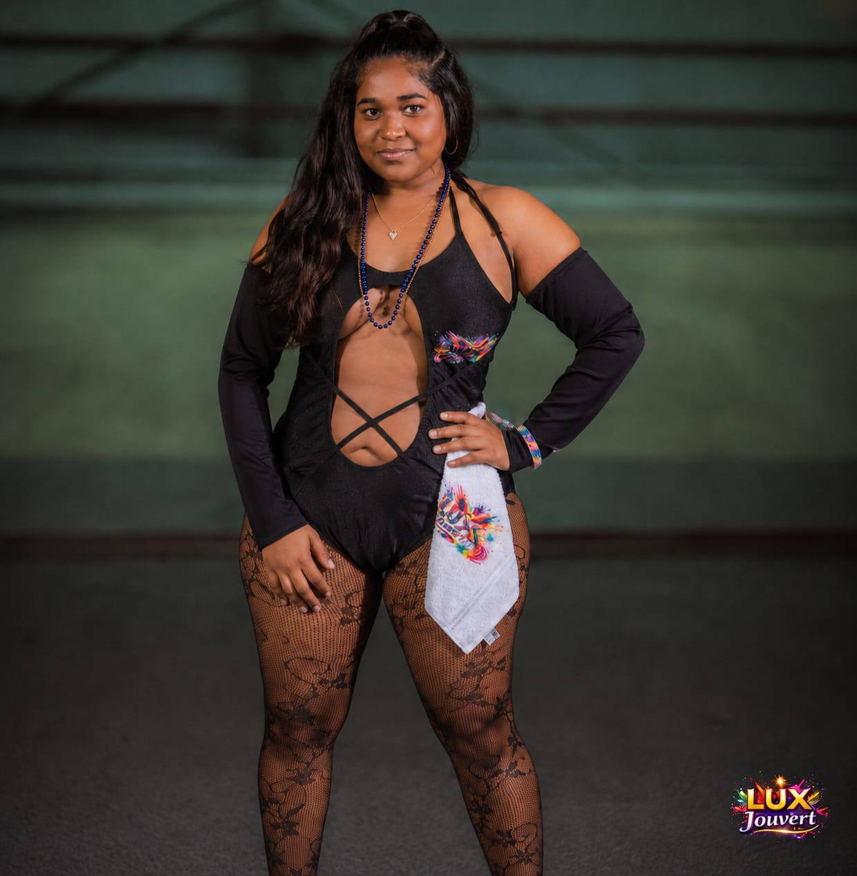 LUX J'Ouvert masquerader in a black cut-out costume with floral fishnets